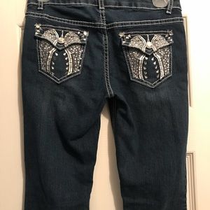 Girls dark wash, embellished bootcut jean.